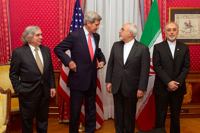 From left to right: the United States Secretary of Energy Ernest Moniz, the United States Secretary of State John Kerry, the Iranian Foreign Minister Mohammad Javad Zarif and the head of the Atomic Energy Organization of Iran Ali Akbar Salehi, in the "Salon Élysée" of the Beau-Rivage Palace (Lausanne, Switzerland) on 16 March 2015. Taken from Wikicommons.