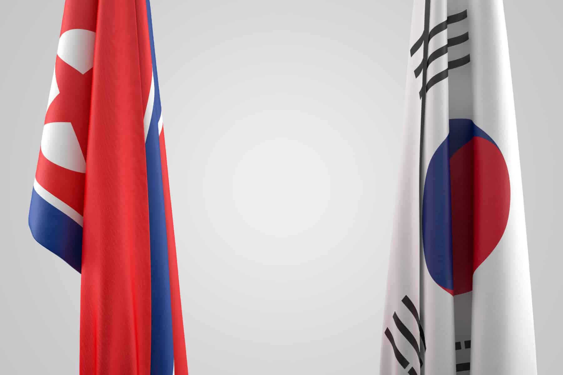 The flags of the DPRK and ROK.